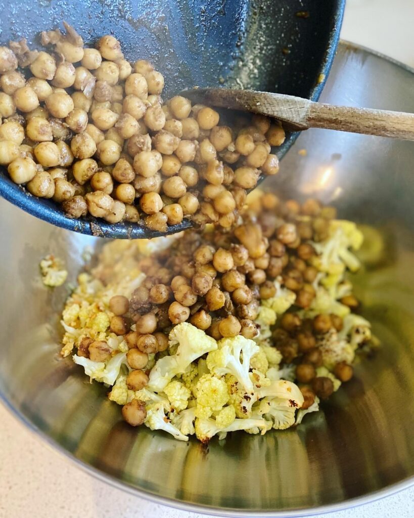add chickpeas into the cauliflower bowl