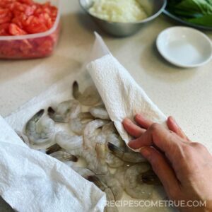 pat prawns dry with paper towel