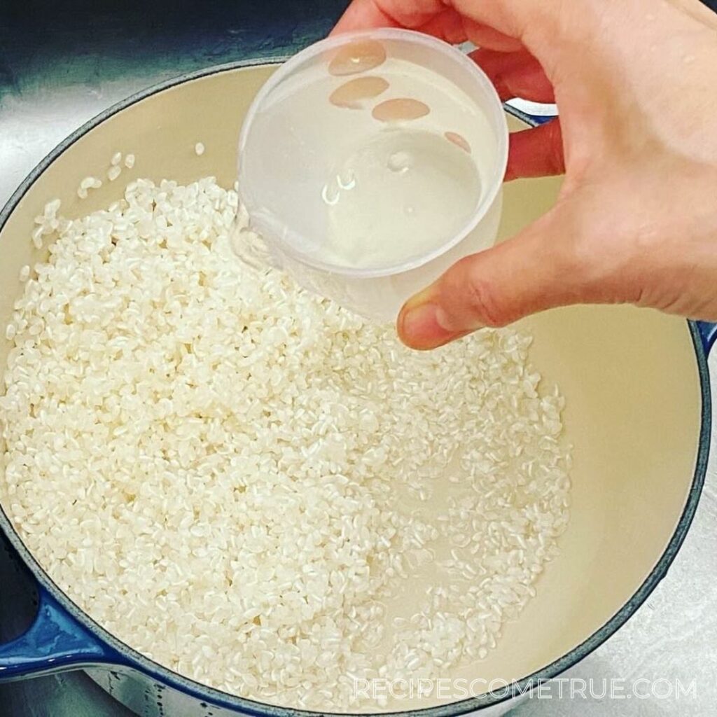 add the water to the rice pot
