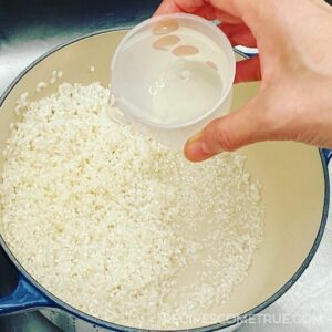 add the water to the rice pot