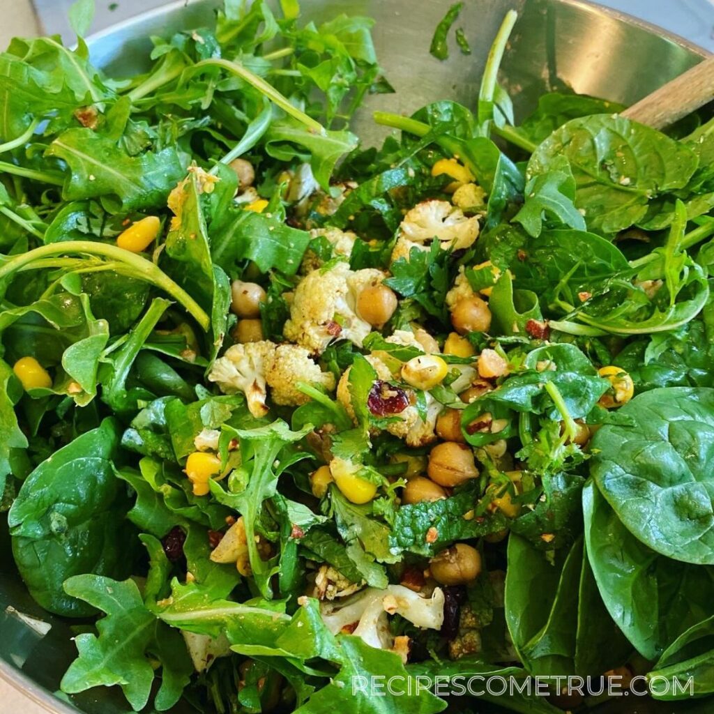 Add rocket and spinach into the salad