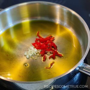 Add garlic and chilli in a pan