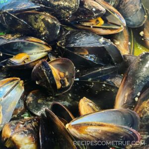 mussels pop open in a pan