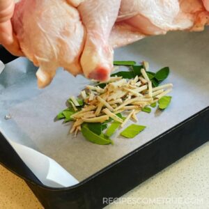 place chicken on kafir lime and ginger