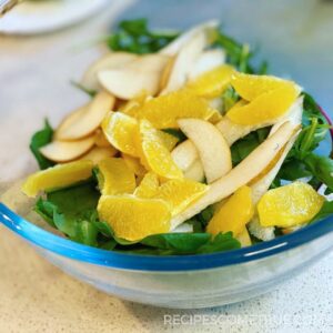 pear and orange in a salad bowl