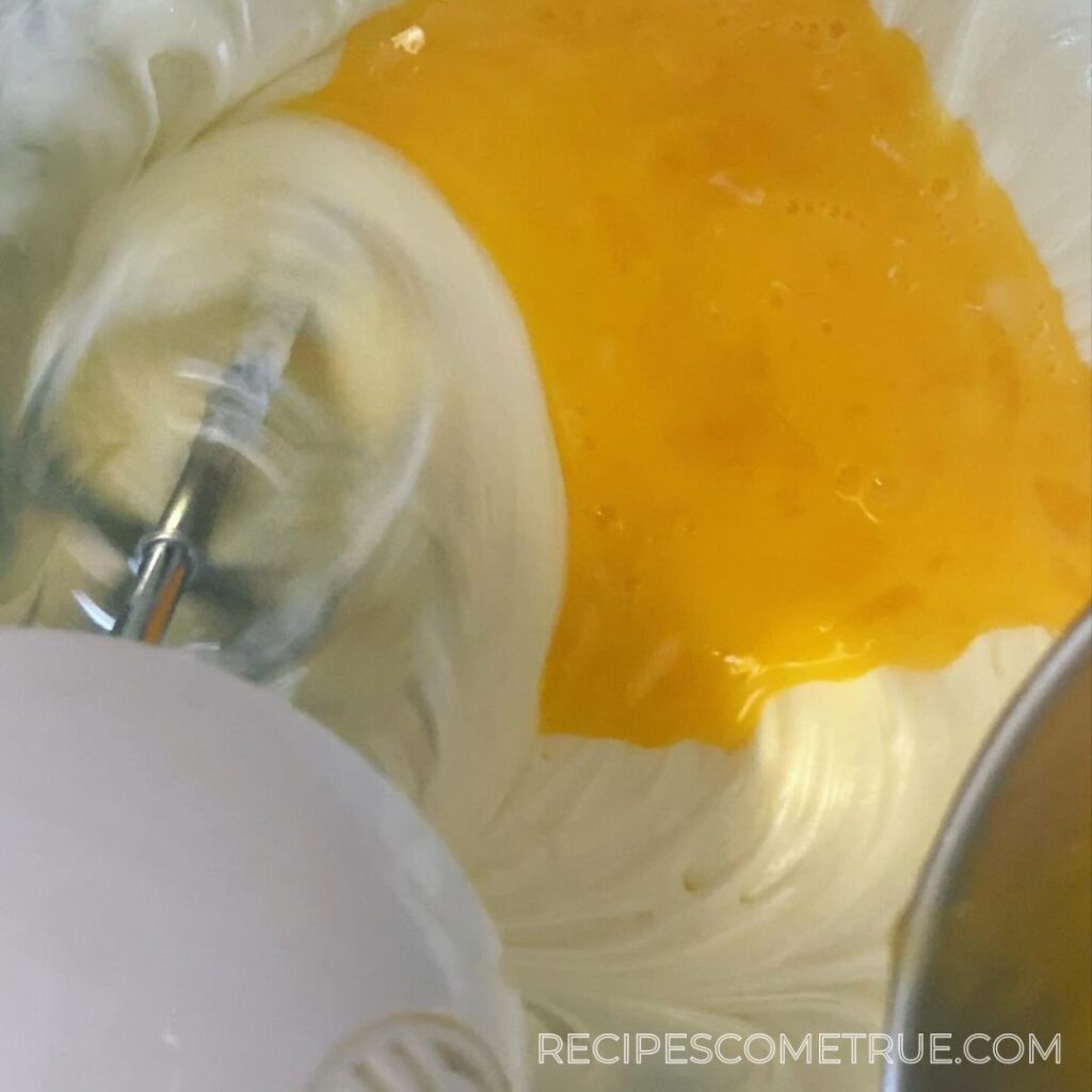 mixing eggs and cream cheese